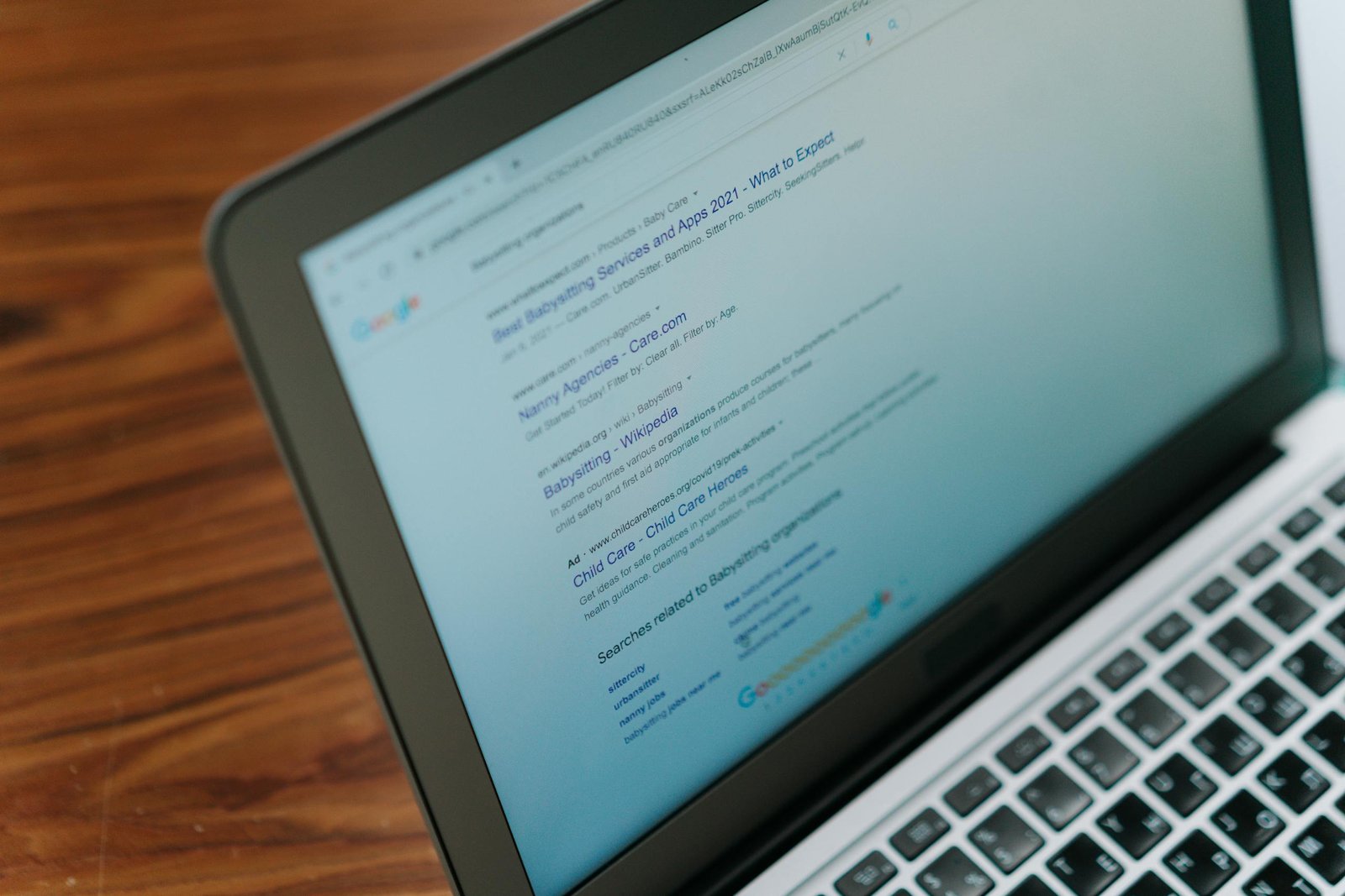 A close-up to a notebook which shows results of a Google Search Engine Result Page